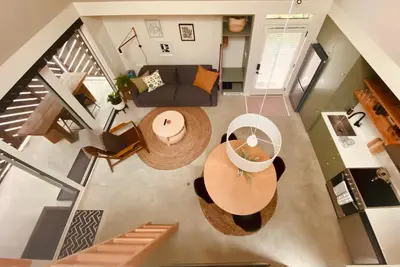 an overhead view of a living room with a couch and a table at Fern's Edge in Port Renfrew