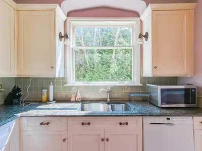 a kitchen with a sink and a window at Cozy Private Bedroom Suite in UBC Campus in Vancouver