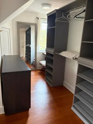 a walk in closet with a black counter and shelves at Charming Victoria Character Home-Pet Friendly in Victoria