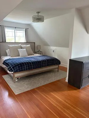 a bedroom with a bed and a dresser in it at Charming Victoria Character Home-Pet Friendly in Victoria
