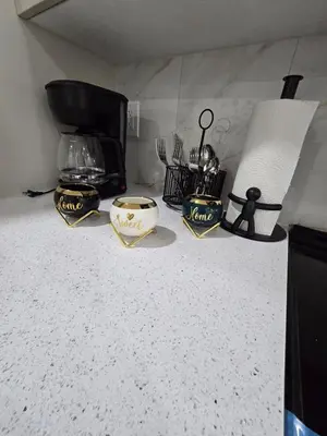 a kitchen counter with two bowls and a blender at Cozy Modern Spacious 2 Bedroom and full kitchen in Southwest Calgary in Calgary