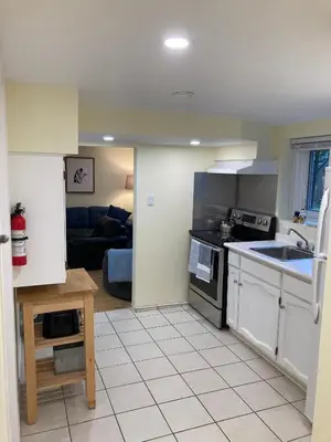 a kitchen with a sink and a stove top oven at Private Suite in Vancouver in Vancouver