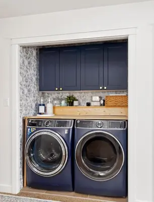 a kitchen with a washer and dryer in a room at Entire Home - backyard oasis, indoor fireplace, Huge TV in Fort McMurray