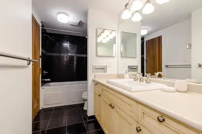 a bathroom with a sink and a tub and a toilet at Whistler Village Retreat, Private Hot Tub & Sauna in Whistler