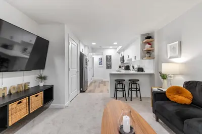 a living room with a couch and a tv at Dont Overpay-2Bd 1 Bath -Calm Family Place in Calgary