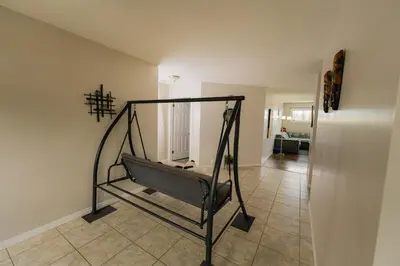 a room with a treadmill in the middle of a room at A beautiful 2 bedroom private home in Hinton