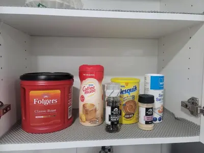 a shelf with various food items in a pantry at Cozy Suite near West Edmonton Mall in Edmonton
