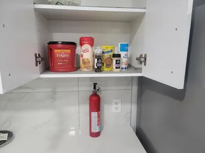a fire hydrant sitting inside of a kitchen cabinet at Cozy Suite near West Edmonton Mall in Edmonton