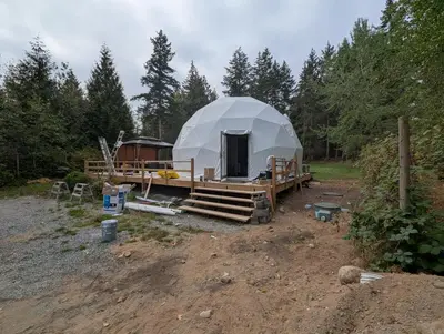 a large tent in the middle of a field at Bela bahia in Qualicum Beach