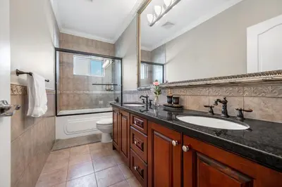a bathroom with a sink and a toilet at Coquitlam Heights Private Room in Coquitlam