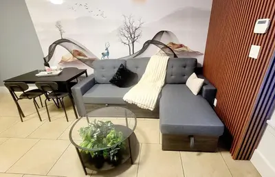 a living room with a couch and a table at Quiant 2 Bedroom Suite in Vancouver
