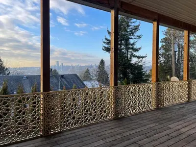 a screened in porch with a view of the city at 3 Bed - Best View in Town! in Surrey
