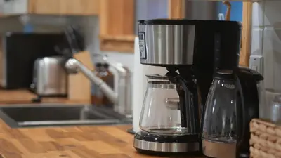 a coffee maker sitting on top of a kitchen counter at Lay Back Lodge in Kimberley