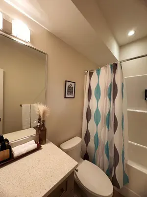 a bathroom with a toilet and a shower at Oceana Retreat Cozy 1BR with Outdoor Oasis in Victoria