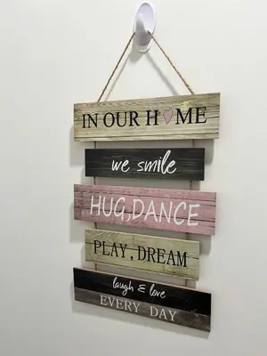 a wooden sign that reads in ourinho me we smile hug dance huddle dance at One bedroom private entrance suite in Edmonton