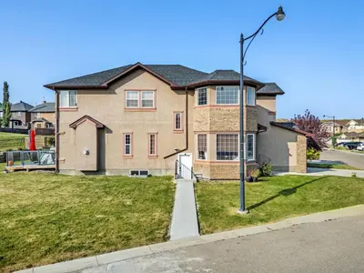 a house with a street light in front of it at Private Sherwood Suite by Park in Calgary