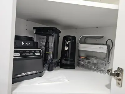 a kitchen pantry with some appliances in it at Non Smoking- Stylish Basement Suite Near Airport, Trails & Dining in Edmonton