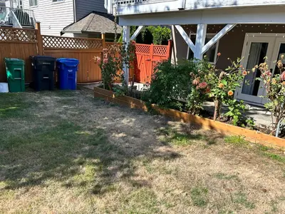 a yard with some plants and a house at Cozy and Relaxing Private Getaway Free Parking in Nanaimo