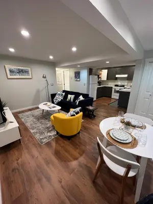 a living room with a couch and a table at Beautiful Entire 2 Bedroom Suite in Nanaimo