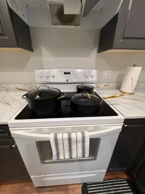 a kitchen with two pots on a stove at Beautiful Entire 2 Bedroom Suite in Nanaimo