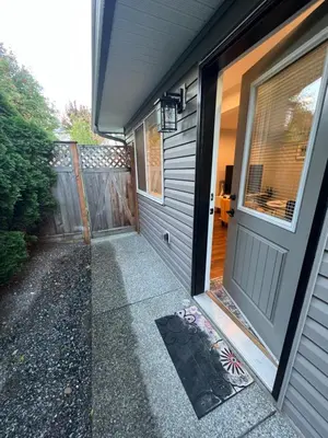 a garage with a door and a walkway at Beautiful Entire 2 Bedroom Suite in Nanaimo
