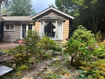 a garden in front of a small house at Suit near Grousmountain in North Vancouver