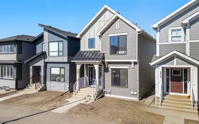a house with grey and white at Cozy 3-Bedroom Family Retreat Home in Rangeview in Calgary