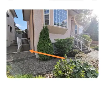 a house with an orange line in front of it at Lovely suite in Burnaby