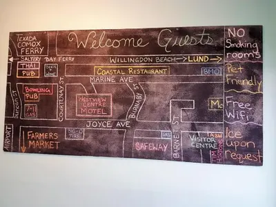 a wall with a sign that says welcome guests at Westview Centre Motel Ltd in Powell River