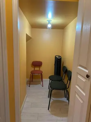 a hallway with chairs and a table in a room at UBC Two-Bedroom Suite - Steps from Beach, Park & Golf - Full Kitchen in Vancouver