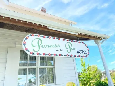 a sign for a guest house at Princess and the Pea Hotel in Langley