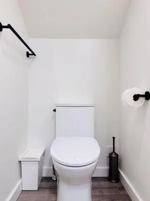 a white bathroom with a white toilet in a room at Modern Queen Room Ensuite Bathroom Vancouver West in Vancouver