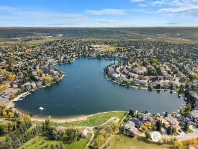 an aerial view of a lake with houses at Spacious Cozy Couples Getaway Basement Suite in Sundance in Calgary