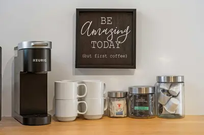 a group of coffee cups sitting on a table at The Sunny 2 Suites 10 Pax Pet Friendly Stay in Calgary