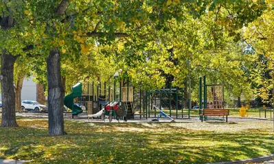 a park with a playground with a slide at The Sunday Charming Private Suite in Calgary in Calgary