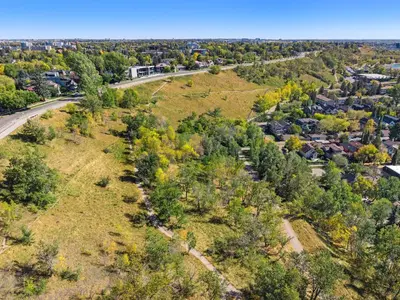 an aerial view of a park with trees and a road at The Sunday Charming Private Suite in Calgary in Calgary