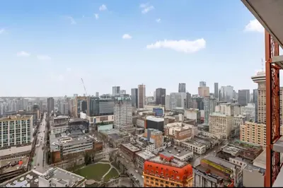 an aerial view of a city with buildings at Urban Calm, Comfort in the Heart of the City in Vancouver