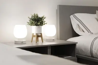 two lamps on a table next to a bed at Cozy 2BR for Family & Private Parking & Near Mall in Langley