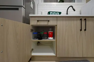 a kitchen with a sink and a cupboard at Modern Suite by Hospital 2 Near Transit, Wi-Fi, Netflix in Edmonton