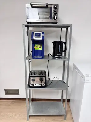 a shelf with a microwave and a toaster oven at Only 7 km from YYC Sandstone Homestay in Calgary