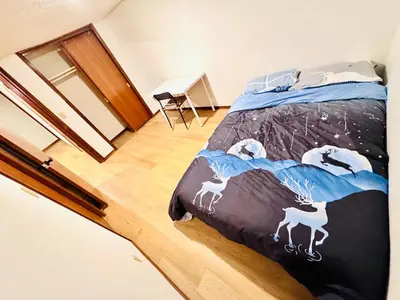 a bedroom with a bed with animals on it at Only 7 km from YYC Sandstone Homestay in Calgary