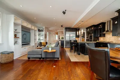 a living room with a couch and a table at World Cup Coastal Getaway in White Rock