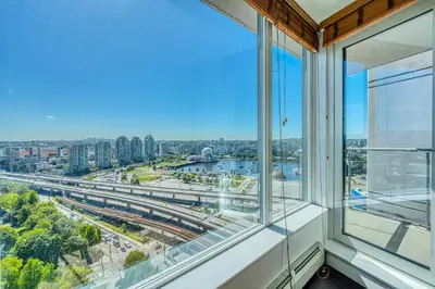 an empty window in a building with a view of a city at Central City Location, Bay View, One Free Parking in Vancouver