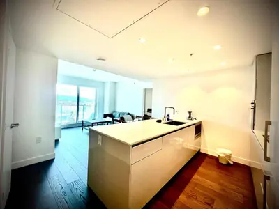 a kitchen with a sink and a counter top at Mordern stylish 2B2B close to Richmond center in Richmond