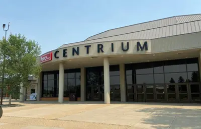 a building with a sign that reads centralium at Modern new townhouse in Red Deer