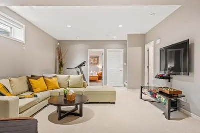 a living room with a couch and a table at Large Family Home w Kid's Play Tent! FREE Banff Pass in Calgary
