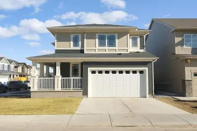 a house with a white garage door at Spacious Suite in Calgary