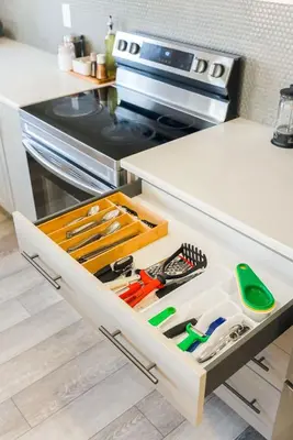a drawer in a kitchen with many tools in it at Spacious Suite in Calgary