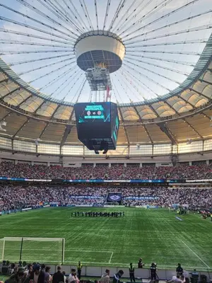 a crowd of people watching a soccer game in a stadium at Historic Downtown Escape in Vancouver
