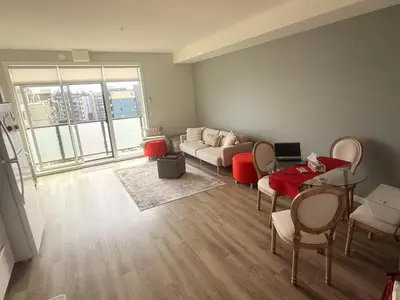 a living room with a couch and a table at Mollies Alpha in Langford